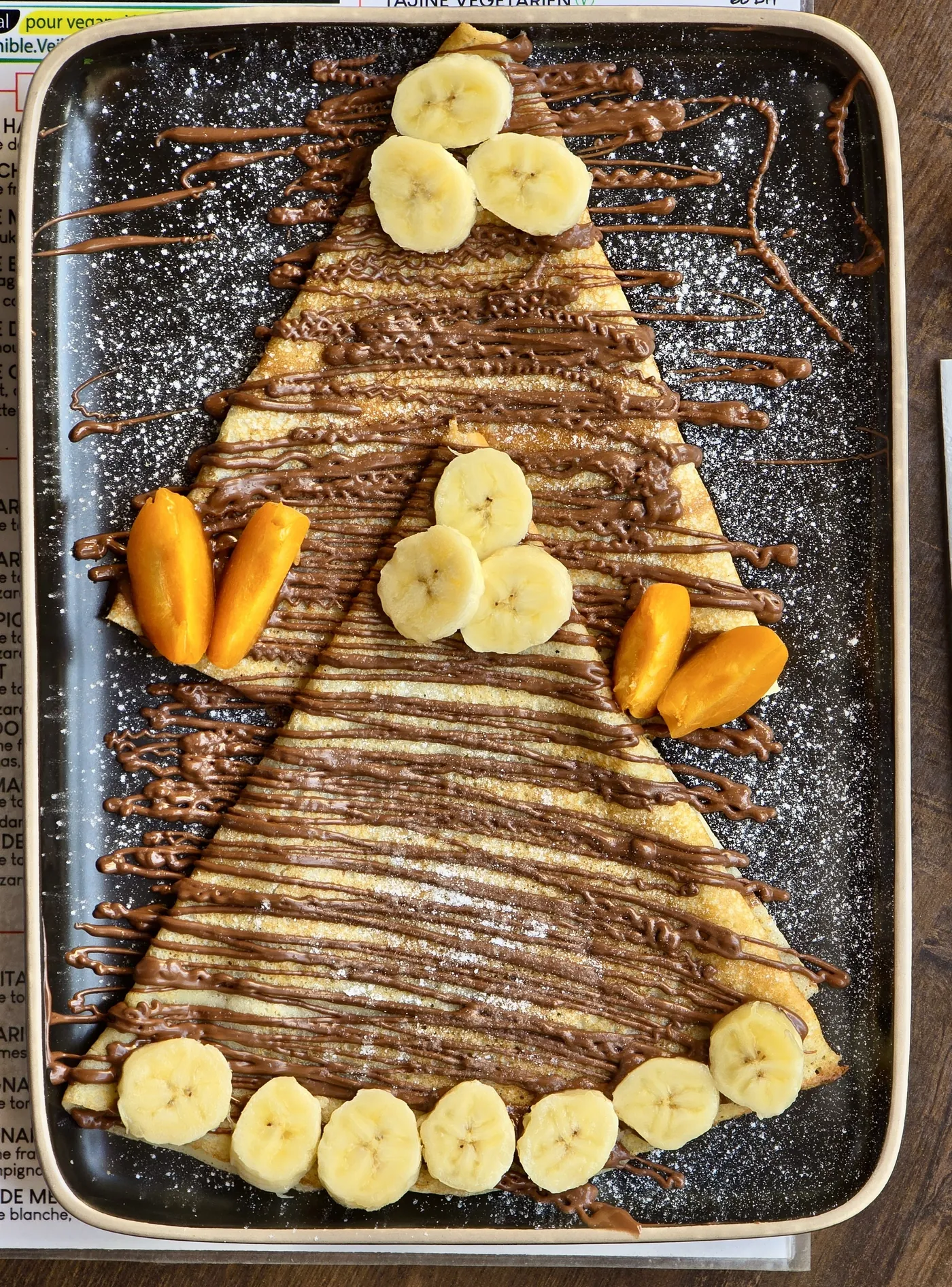 A sweet crepe with chocolate sauce and banana at Culture Box
