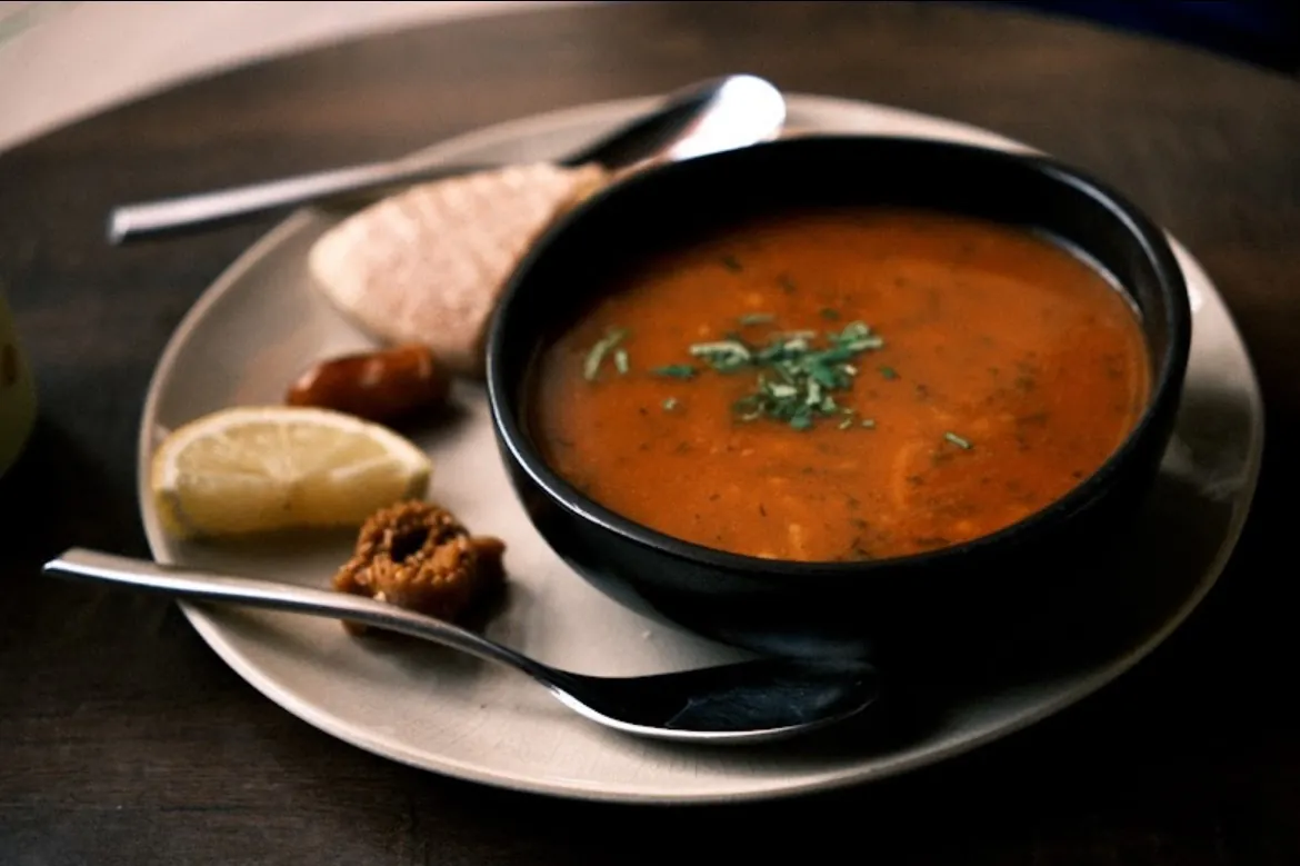 A bowl of harira soup with lemon and dates at Culture Box