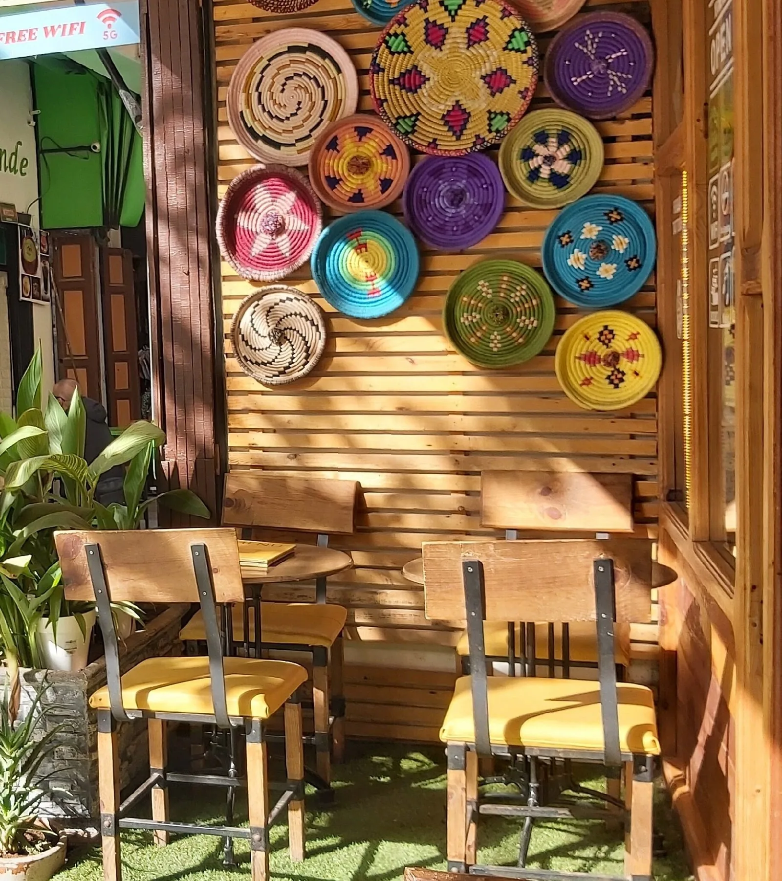 Hand-painted Fassi ceramic plates displayed on the wall at Culture Box